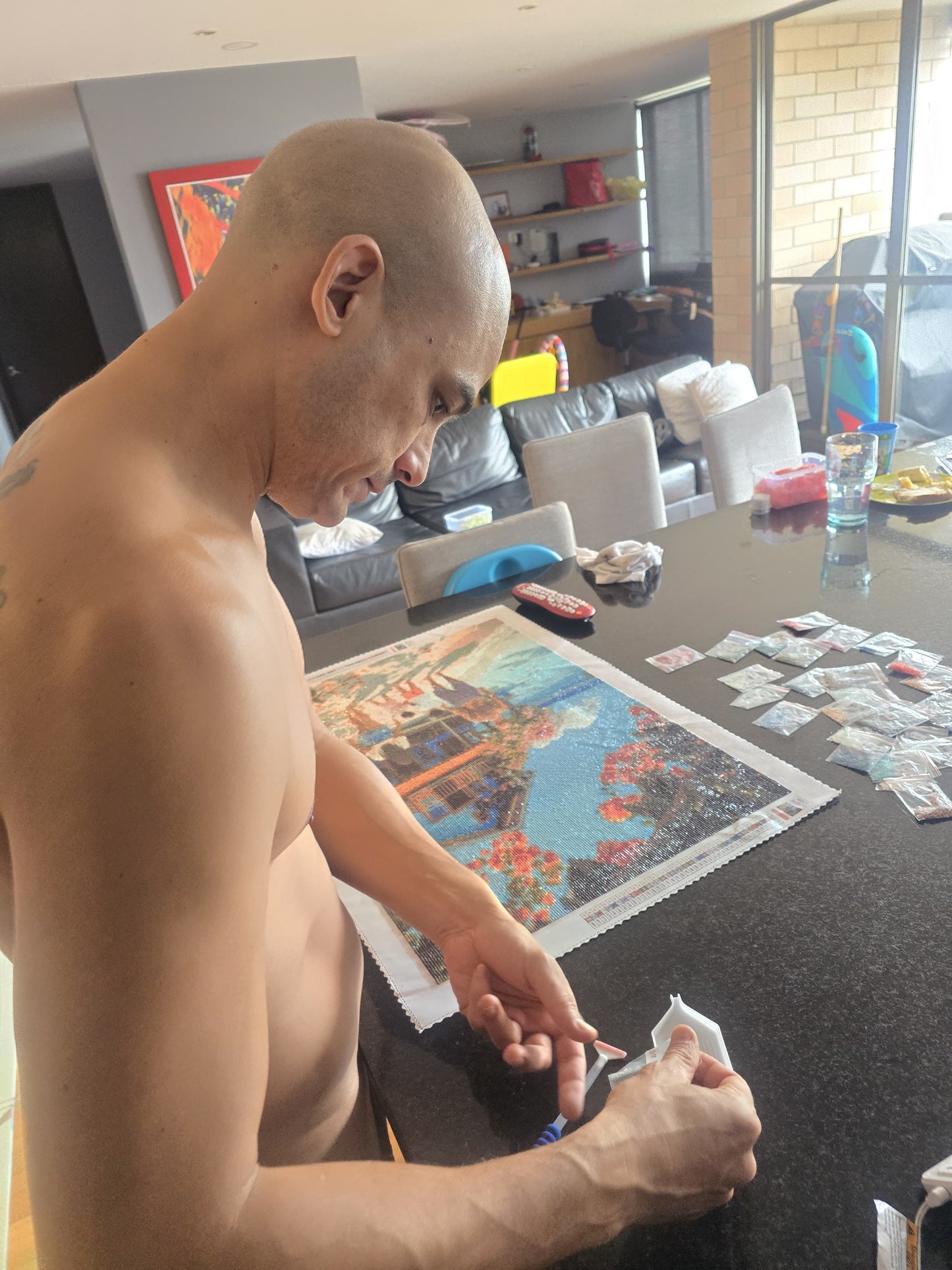 Avery doing diamond painting at home in Medellín